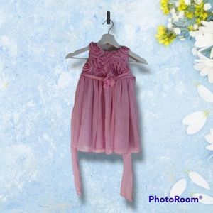 Fancy pink dress with flowers. Charles david